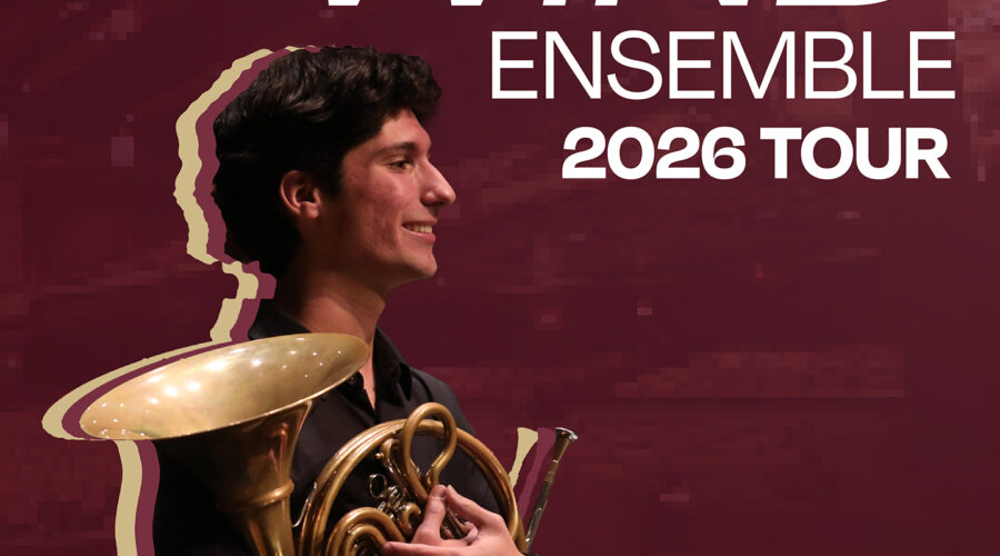 Young man holding French Horn