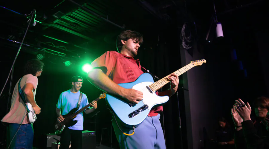 Closeup of lead guitarist on stage during performance