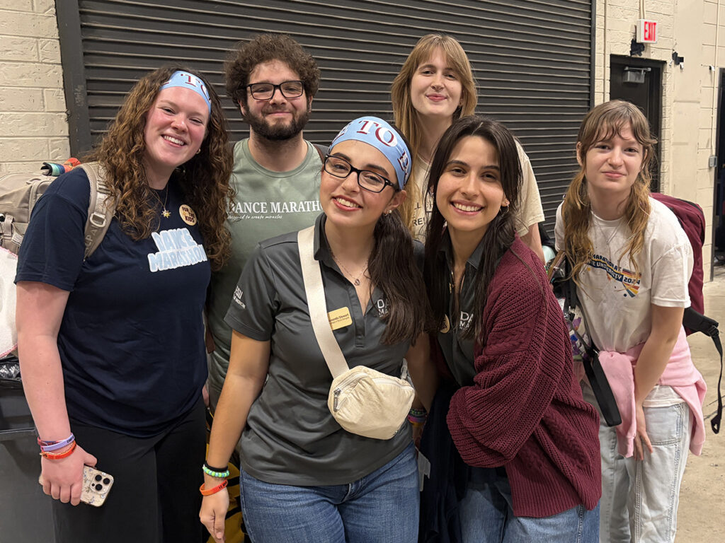 Six students standing in hallway
