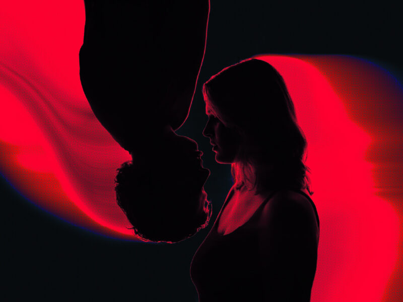 Silhouettes of man (upside down) facing woman (upright)