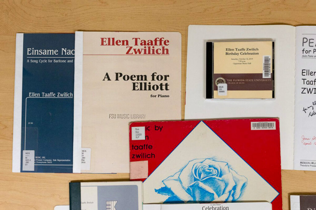 CD and Scores of Music written by Ellen Taaffe Zwilich displayed on a table.