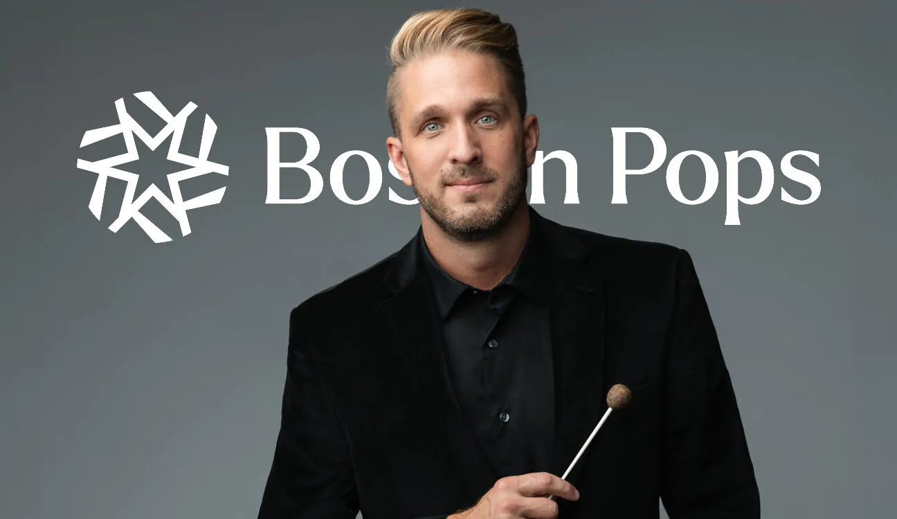 Young man posing with conductor's baton