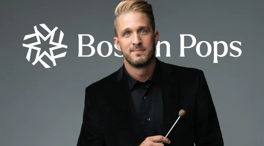 Young man posing with conductor's baton