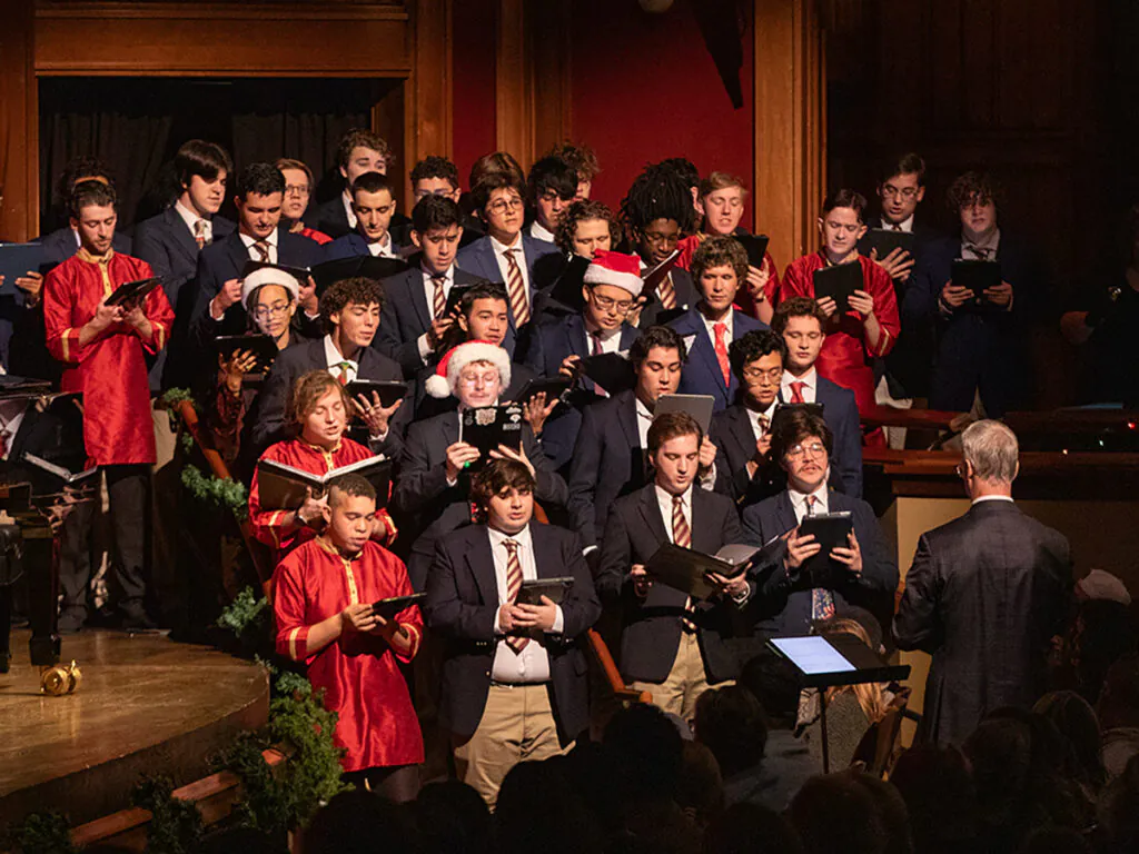 young men's choir singing in holiday attire