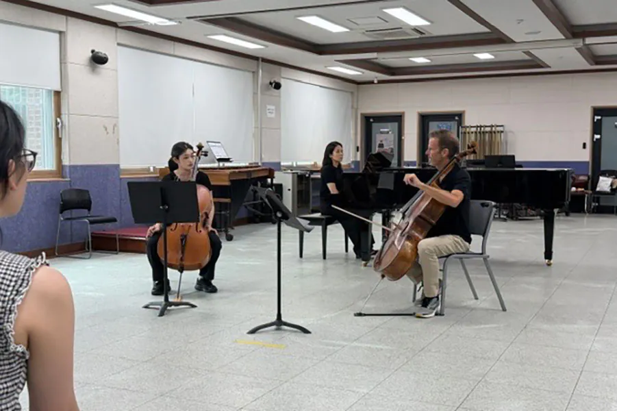 Cello teacher and student in lesson
