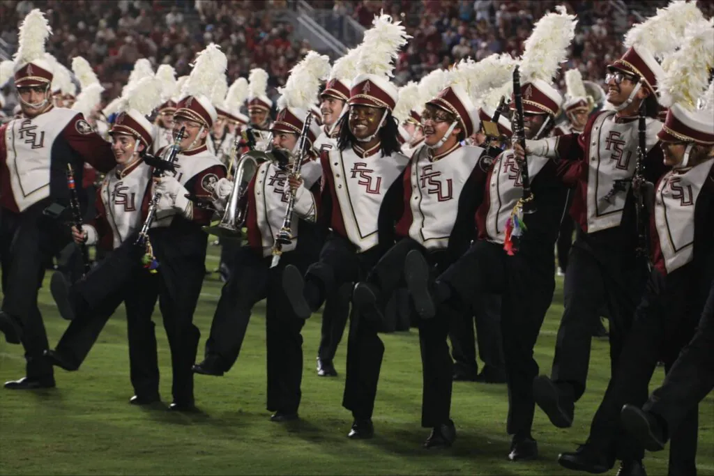 Band members celebrating on field